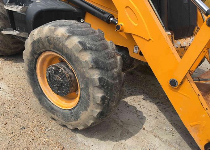 seau 1m3 2011 rouleau de route d'occasion de JCB 3CX de l'an 72kw 1